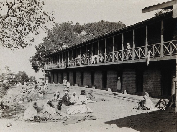 The Pasteur Institute Hospital, Kasauli, India: Indian patients outside the accommodation building. Photograph, ca. 1910.