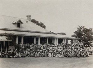 view The Pasteur Institute Hospital, Kasauli, India: Indian patients grouped outside the inoculation building. Photograph, ca. 1910.