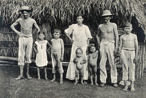 view Panama Indian family outside a traditional hut. Photograph, 1900/1910.