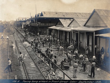 Colón, Panama: workers paving a street. Photograph, 1906.