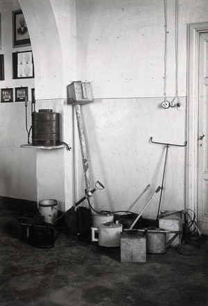 view The anti-malaria school, Nettuno, Italy: oil cans used in malaria control work. Photograph, 1918/1937 (?).