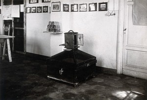 view The anti-malaria school, Nettuno, Italy: a wooden mosquito breeding cage in a classroom. Photograph, 1918/1937 (?).