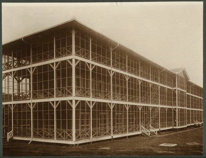 Panama: a large three-storey hotel with an enclosed wrap-around porch. Photograph, 1900/1920.