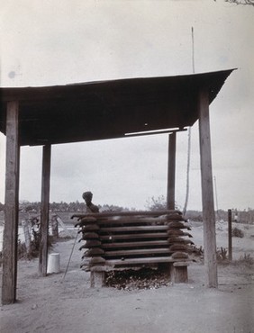 Incinerator with man in turban. Photograph, 1920/1940.