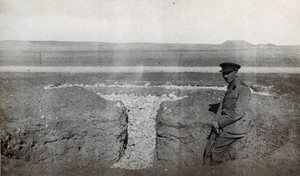 view Tel-el-Kebir, Egypt: British soldier in a soakage pit, under construction. Photograph by J.D. Graham, 1914/1918 (?).