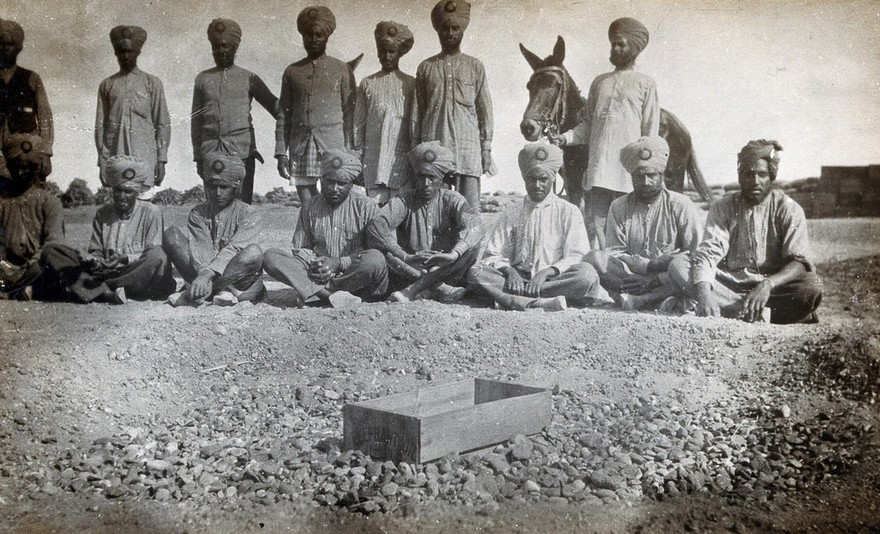 Sikh Pioneers (an engineer battalion of the Indian army) in Tel-el-Kebir, Egypt, posed behind a soakage pit of their own construction. Photograph by J.D. Graham, 1914/1918 (?).