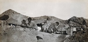 view The British front (?), Tigris, Iraq, (formerly Mesopotamia): soldiers in the Indian cooking area of the trenches. Photograph by P.F. Gow, 1916 (?).