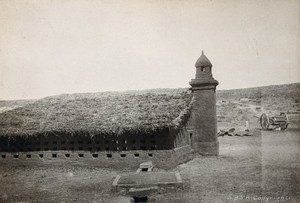 view Jaffa, Palestine: a second world war British army camp kitchen with a turret, rows of small window openings and a grass roof. Photograph by Lieutenant-Colonel (Terence ?) Otway, 1939/1945 (?).