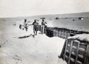 view Sinai Desert, Egypt: first world war front line trenches with three (British) soldiers. Photograph, 1914/1918.