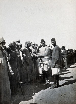 view Abassia, Cairo, Egypt: Egyptian Camel Corps soldiers being vaccinated. Photograph, 1914/1918 (?).