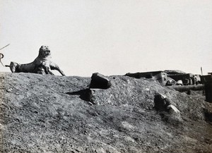 view Suez (?) Canal Zone, Egypt (?): lion and crocodile 'sculptures' made from earth and found materials by soldiers on a First World War (?) military camp. Photograph, 1914/1918 (?).