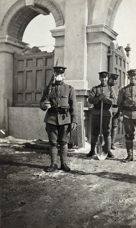 Japanese soldier wearing an anti-plague face mask. Photograph, 1914/1918 (?).