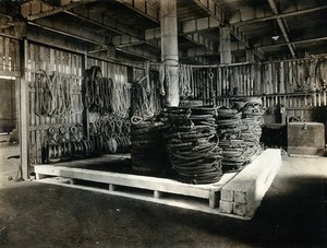 view Liverpool, England: a ship storage area at the port: neatly arranged ropes and equipment. Photograph, 1900/1920.