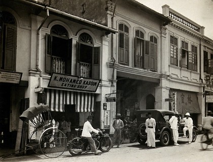 Kuala Lumpur, Malaysia: busy street scene showing the K. Mohamed Kassim eating house where a case of typhus occurred. Photograph, 1915/1925.