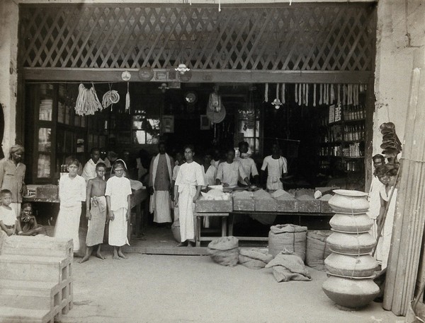 Kuala Lumpur, Malaysia: a food shop interior with Malay staff, where an outbreak of typhus occurred. Photograph, 1915/1925.