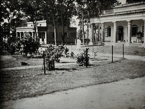 view Purulia Leper Home and Hospital, Bihar, India: view of large hospital buildings with pillars: the men's hospital and the tuberculosis ward. Photograph, 1890/1920.