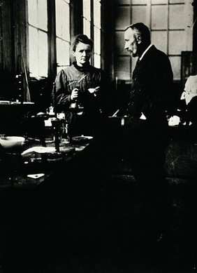 Marie and Pierre Curie in their laboratory, Paris. Photograph, ca. 1900.