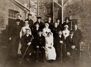 view The R. N. A. Hospital, Truro: First World War military convalescents and nurses: group portrait. Photograph, 1916.