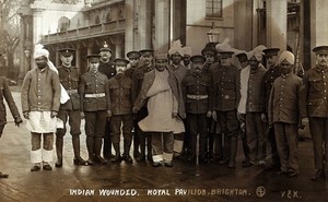 view World War One: convalescent Indian soldiers with British military medics outside the Royal Pavilion, Brighton. Photograph, 1914/1918.