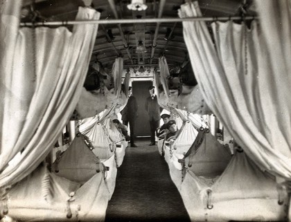 World War One: a hospital train: patients lie in suspended beds. Photograph, 1914/1918.