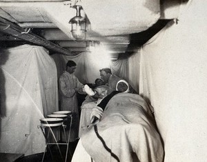 view World War One: the HMS Marlborough: patients being bandaged onboard the ship. Photograph, 1914/1918.