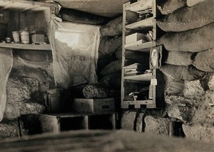 view World War One: a dug-out interior showing shelving. Photograph, 1914/1918.