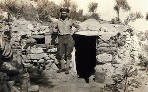 view World War One: Colonel Taylor outside his dug-out. Photograph, 1914/1918.