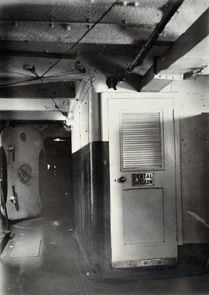 view World War One: a Royal Naval hospital ship: the dental surgeon's door. Photograph, 1914/1918.