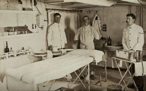 World War One: the H.M.S. Barham: the sick bay with three medics. Photograph, 1914/1918.
