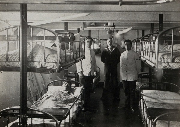 World War One: the H.M.S. Barham: patients and staff in the sick bay. Photograph, 1914/1918.