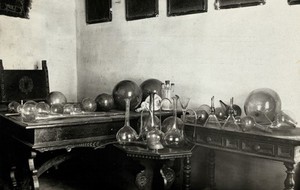 view The Hospital of Arezzo, Italy: the Murano glass collection displayed on three tables. Photograph, 1920/1940.