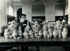 view Pharmacy jars: French decorative china jars; (with the French pharmacist M. Fialon?). Photograph, ca. 1920.