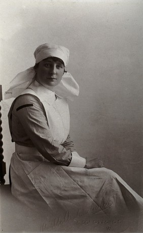 A nurse, Moyra (?) Cavanagh, in uniform, London. Photograph by  Marble Arch Studios, ca. 1902.