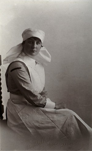 view A nurse, Moyra (?) Cavanagh, in uniform, London. Photograph by  Marble Arch Studios, ca. 1902.