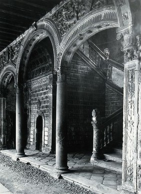 Hospital de Santa Cruz, Toledo, Spain: an ornate 15th century arcade, inner doorway and staircase. Photograph, ca. 1935.