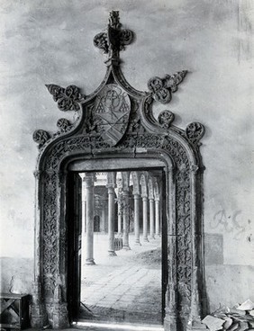 Hospital de Santa Cruz, Toledo, Spain: the ornate doorway to the patio, showing columned arcade beyond. Photograph, ca. 1935.