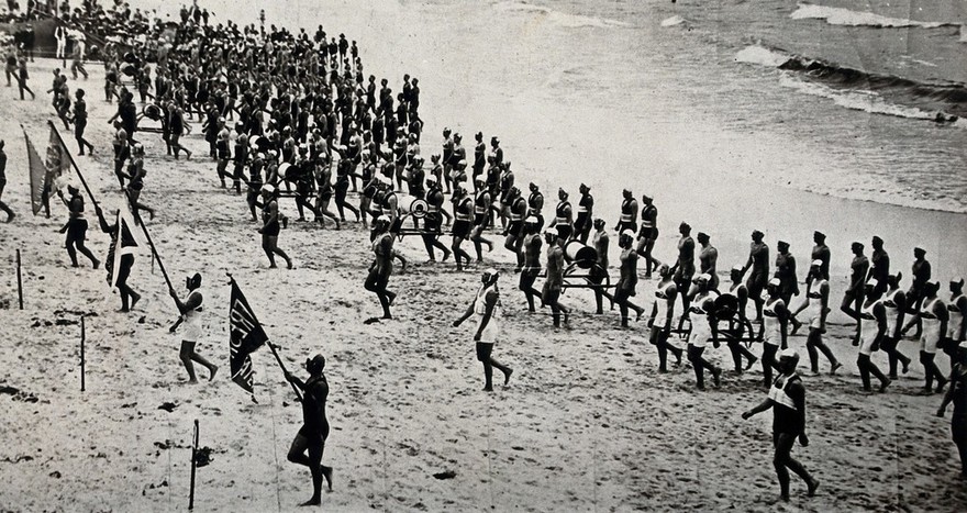 Bondi Beach, Sydney, New South Wales: members of Life Saving Clubs put on a display at a surf carnival. Photograph, ca. 1920.