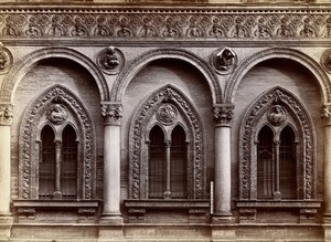 view Ospedale Maggiore, Milan: three windows carved with relief sculpture. Photograph by Alinari, 18--.