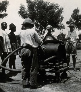 Medical Research Institute, Accra: disinfection with a spray from a tank. Photograph, 1928.