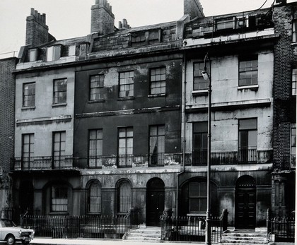 4 George Street, London, and neighbouring buildings, subsequently 169-173 Gower Street, including in the centre the home of the University Dispensary 1828-1834. Photograph, 1960.