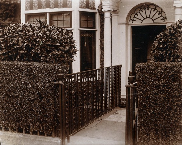 University College Hospital, London: railings from the operating theatre re-erected in a garden. Photograph.
