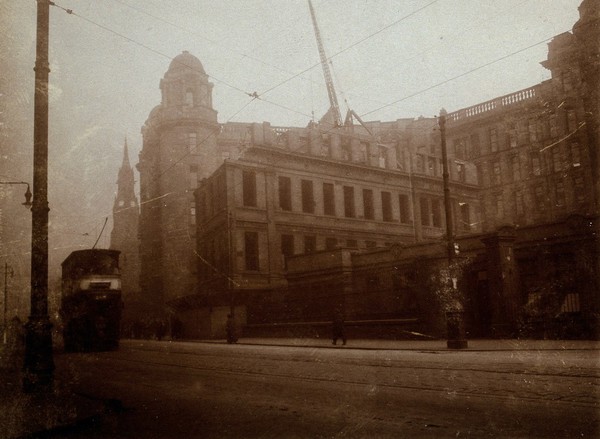 Glasgow Royal Infirmary, Scotland: the surgical block (Lister building) being demolished. Photograph, 1924.