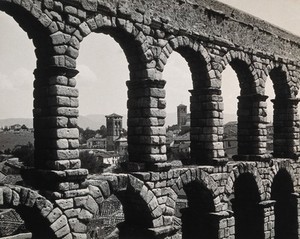 view Arches of a Roman aqueduct, Segovia, Spain. Photograph by Foto Aida, 1910/1936?.