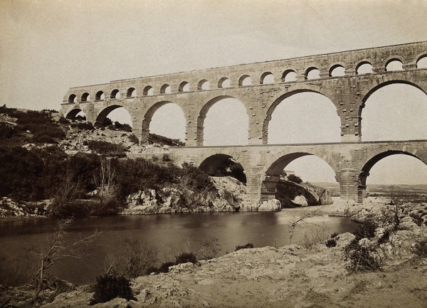 Pont du Gard, Roman aqueduct, Nîmes, France: the River Gard is seen flowing beneath the aqueduct. Photograph, 1910/1936?.