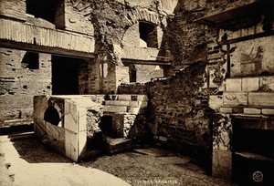 view Ostia, Italy: interior of a ruined villa, featuring wall paintings and mosaic floors. Photograph by Chauffourier, 1928.