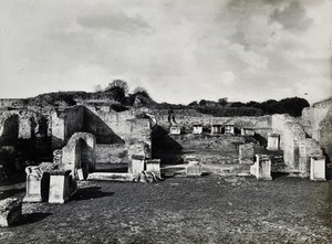 view Partly ruined buildings in Ostia identified as a part of the Forum baths constructed 138-161 AD. Photograph by Anderson, ca. 1931.