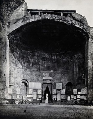 view Rome: remains of a room at the baths of Diocletian, including antique sculpture and plaques. Photograph by Anderson, ca. 1931.