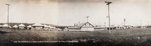 view Mont Alto Sanatorium for tuberculosis, Pennsylvania: view showing the Men's Camp (left) and the Women's Camp (right), with the Recreation Hall in the foreground. Photograph, 1920/1940?.