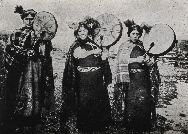 Three Mapuche women bearing drums. Photograph of a process print, ca. 1900.