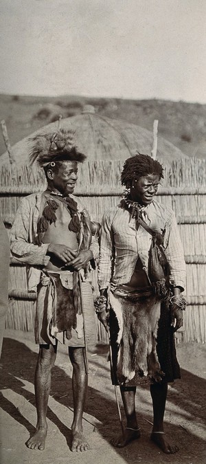 view Swazi witchdoctors wearing animal skins and jewellery. Photograph, 1910/1930.